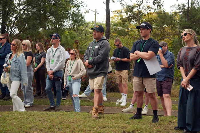 The group listening as a development site is walked and explained