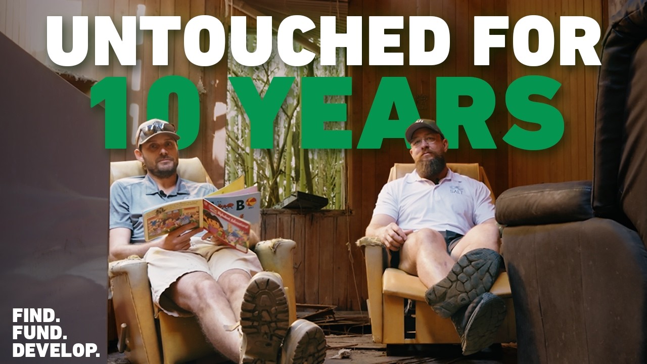 This Abandoned Property Will Make Us $$ - two men sitting in worn armchairs inside a derelict timber shed, under the overlay text Untouched For 10 Years.